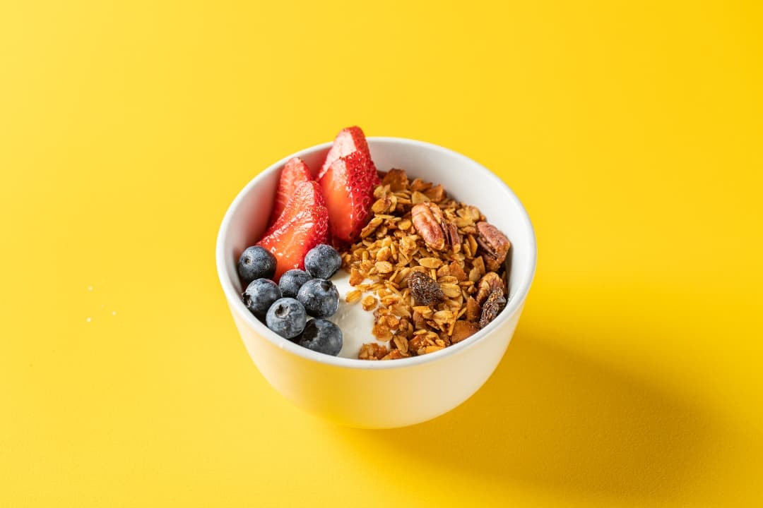 Yogurt bowl with strawberries, blueberries and granola