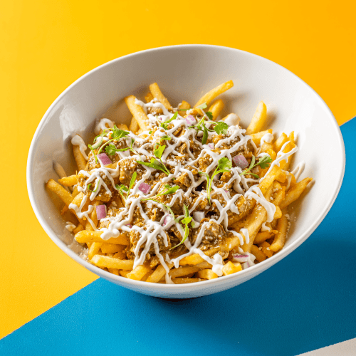 Chile Verde Fries with crema and cotija