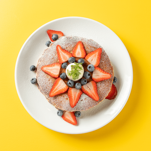Classic buttermilk pancakes with strawberries and blueberries
